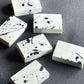 Artisan soap with expressive ink splash markings and sculptural details