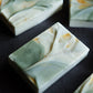 Artisan mineral-inspired soap with soft green marble tones