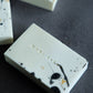 Minimalist black and white handcrafted soap with marble-inspired surface