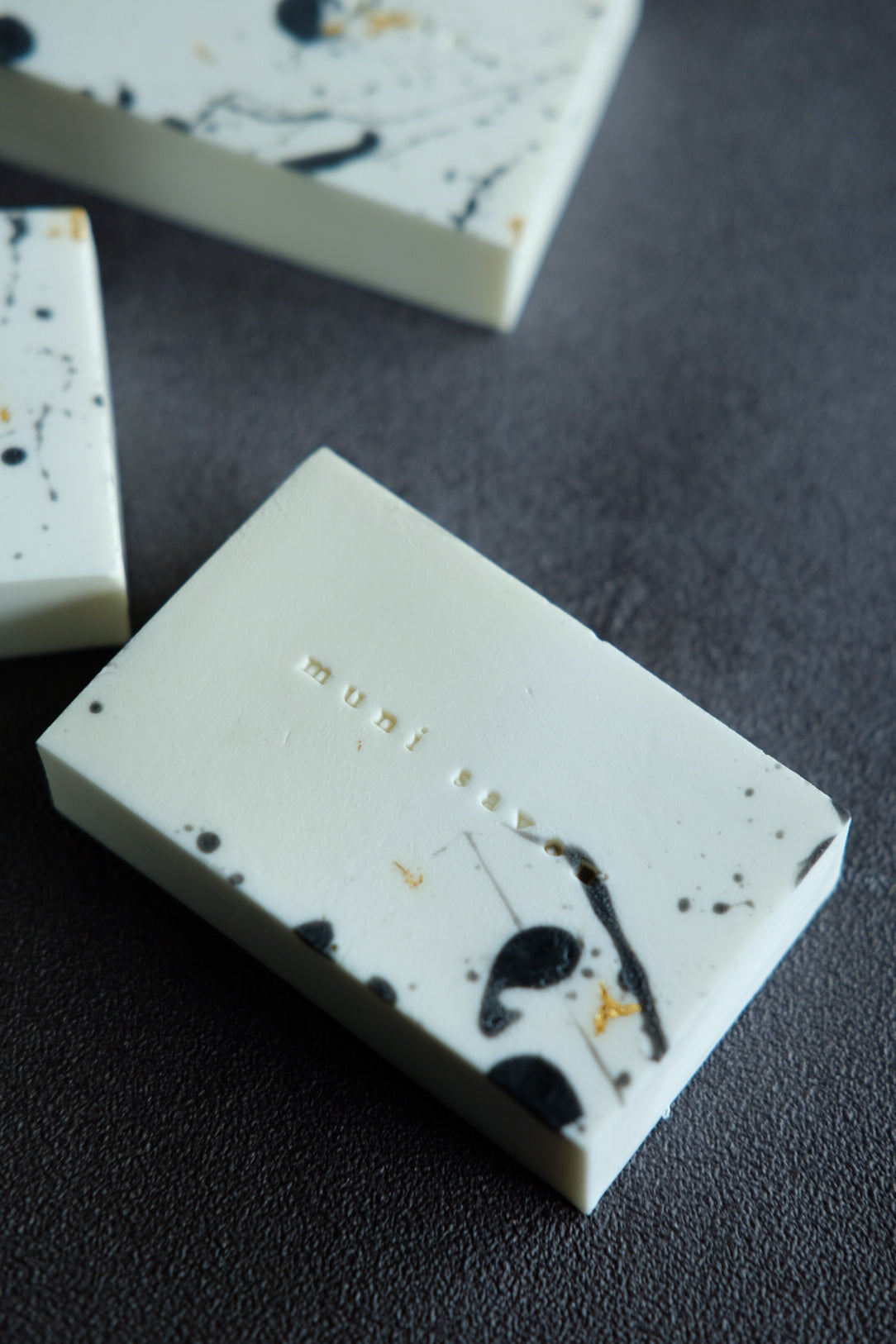 Minimalist black and white handcrafted soap with marble-inspired surface
