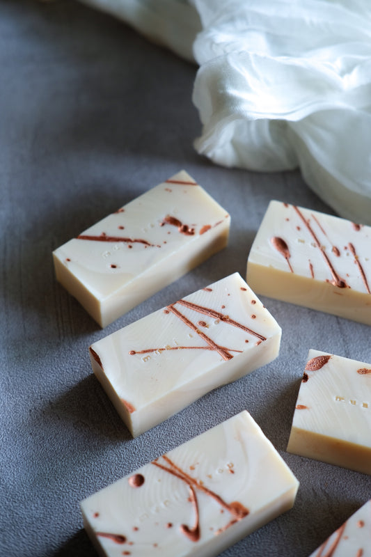 Handmade minimalist cold process soap with copper splash details