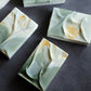 Handmade artisan soap with sculptural folds and soft mineral textures