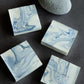 Handmade artisan soap with blue marble textures and minimalist design