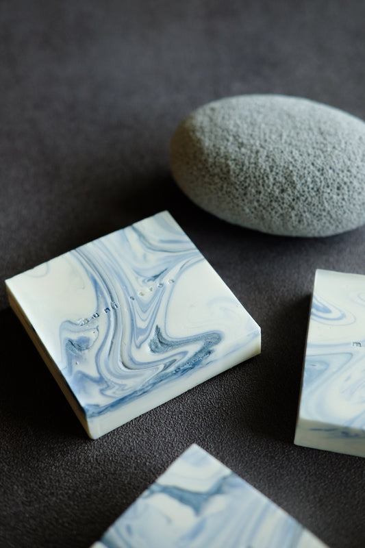 Minimalist handcrafted soap with soft blue swirl details