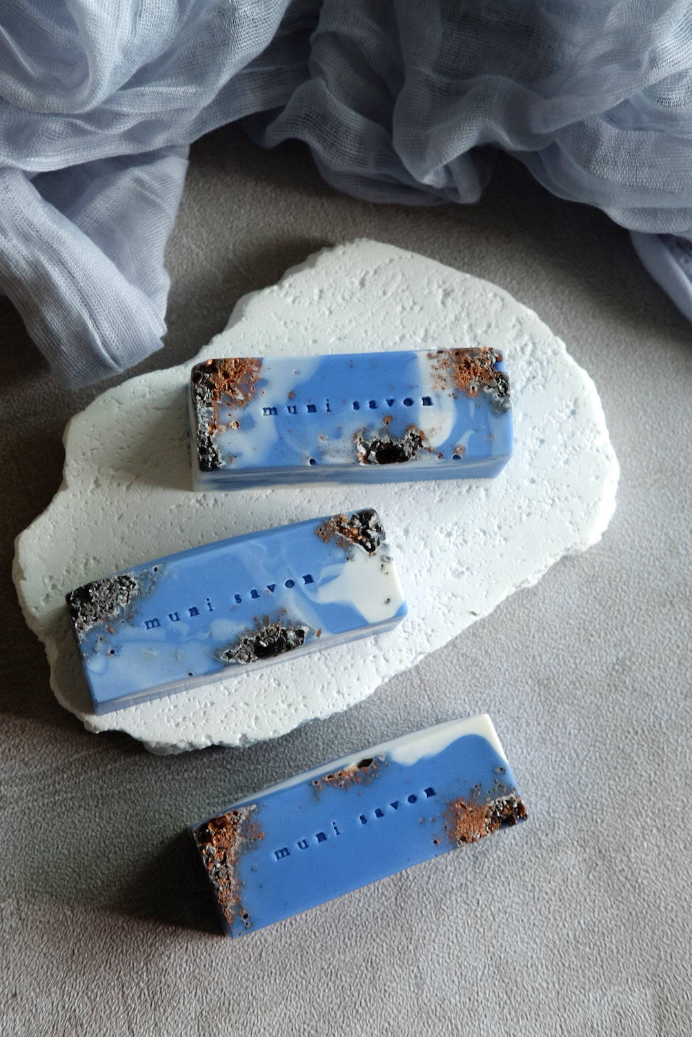 Minimalist artisan soap with copper foil details and marble texture